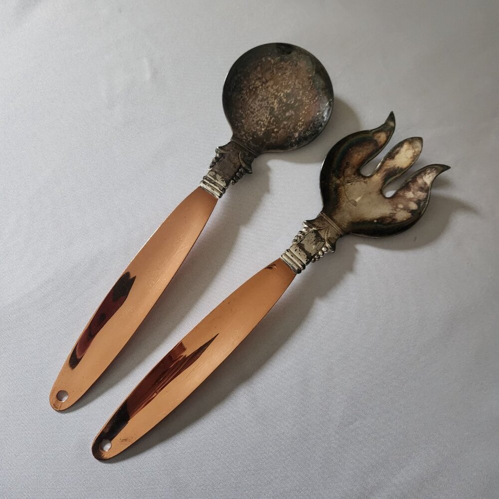 The Copper Craft Guild Salad Serving Set includes 12" long silver-plated serving